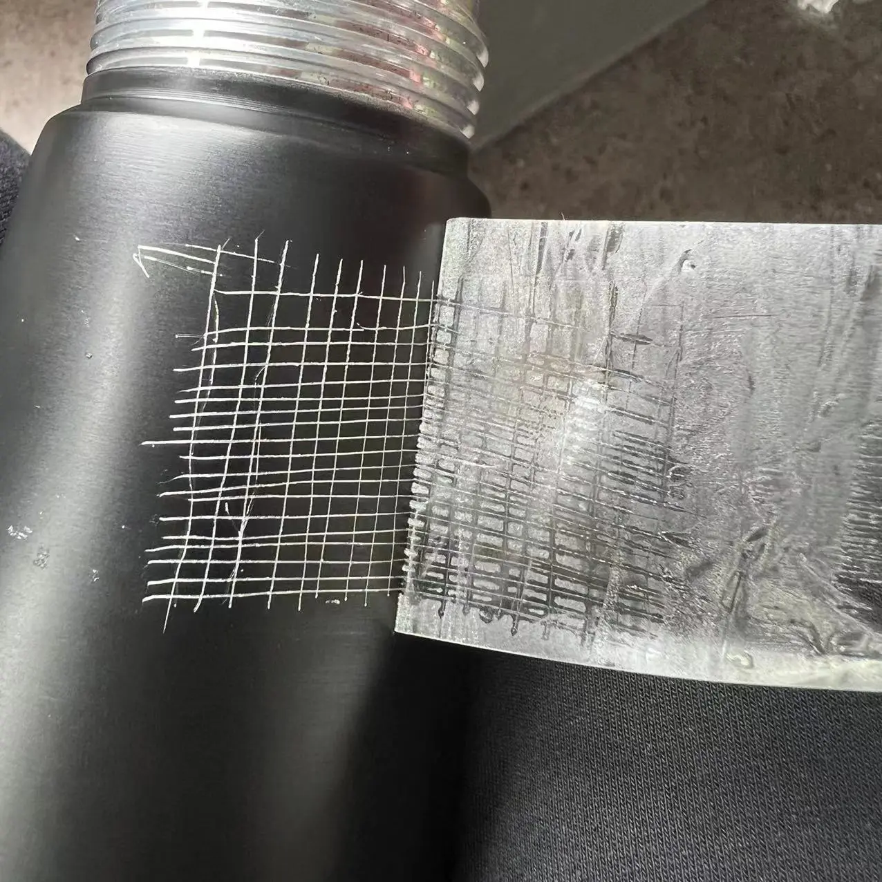 Cross-hatch and tape adhesion spot check on the black coating of an MX-500AB cream whipper body